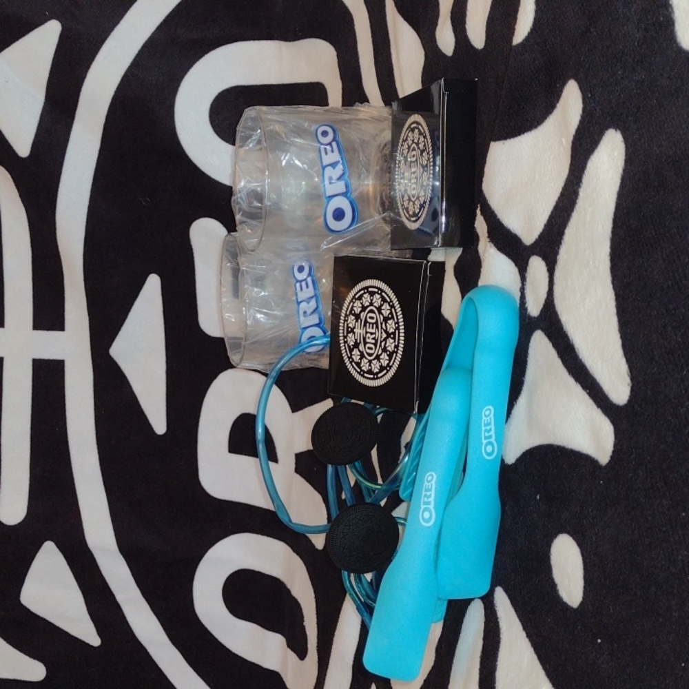 New and unused OREO towel, cups, playing cards, glasses, funny straw, and tongs
